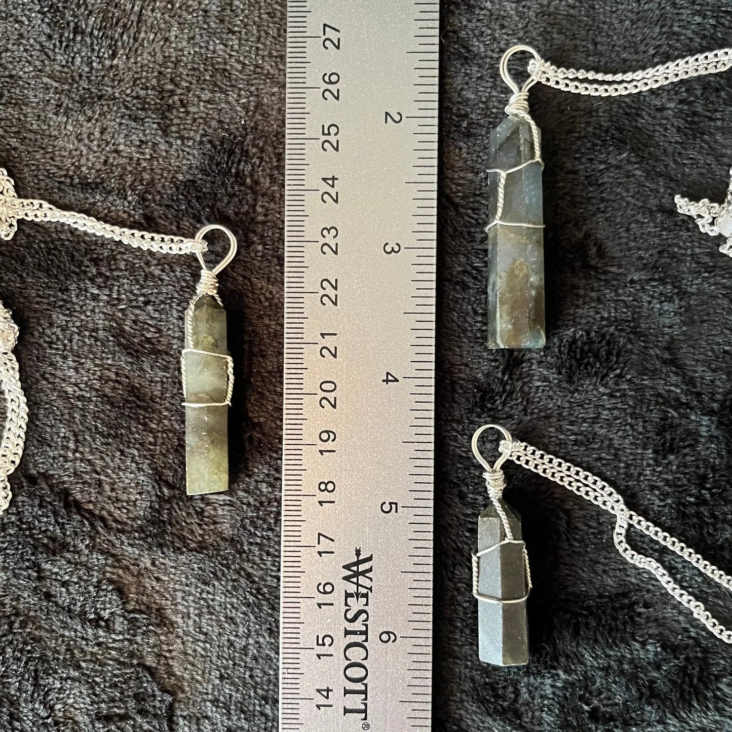 3 Silver Wire Wrapped Labradorite Point Pendants attatched to silver chains. Stones range from 1 1/2" - 1 3/4" long