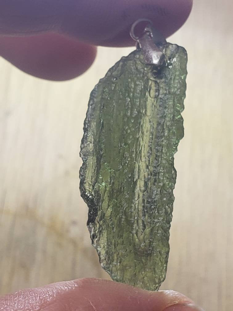 Naturally formed Moldavite Feather Pendant from Czech Republic, (5.2 gr) One Crystal, Rough, with .925 silver bell MOL-0017