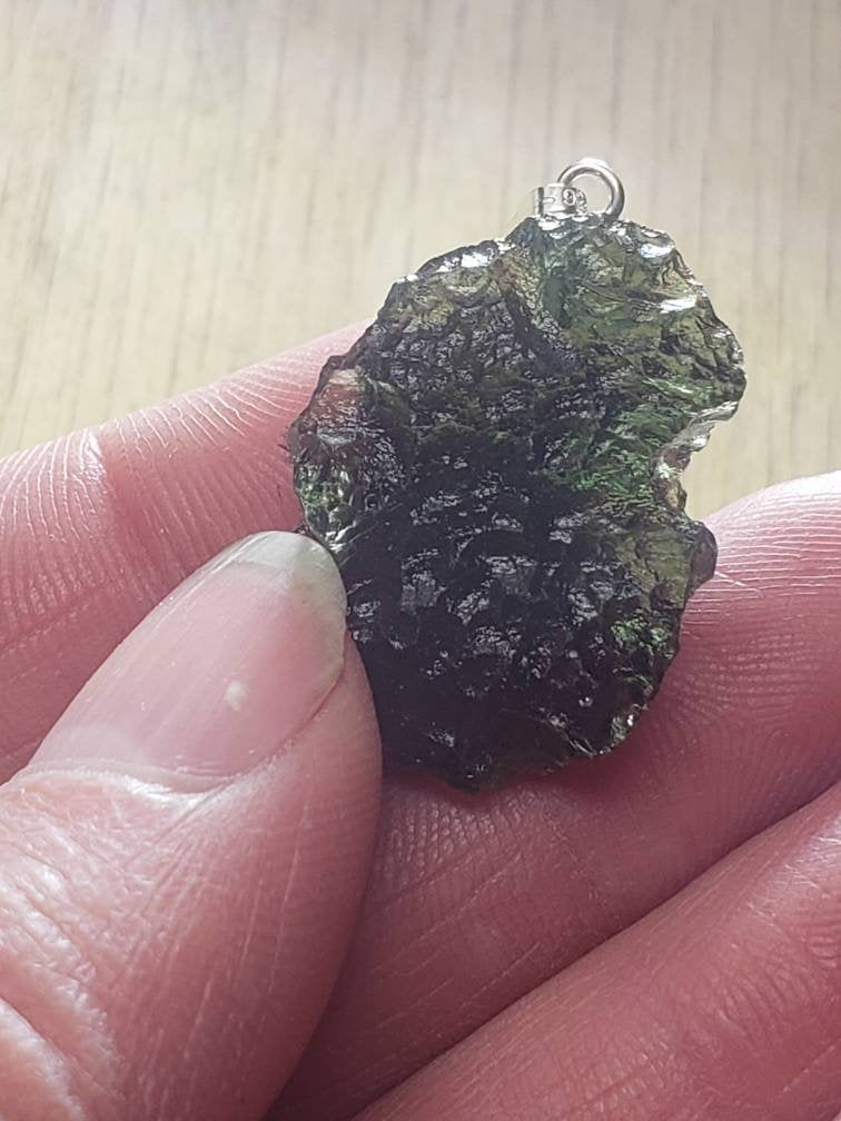 Naturally formed Moldavite from Czech Republic, (4.9 gr) One Crystal, Rough, with .925 silver bell MOL-0016