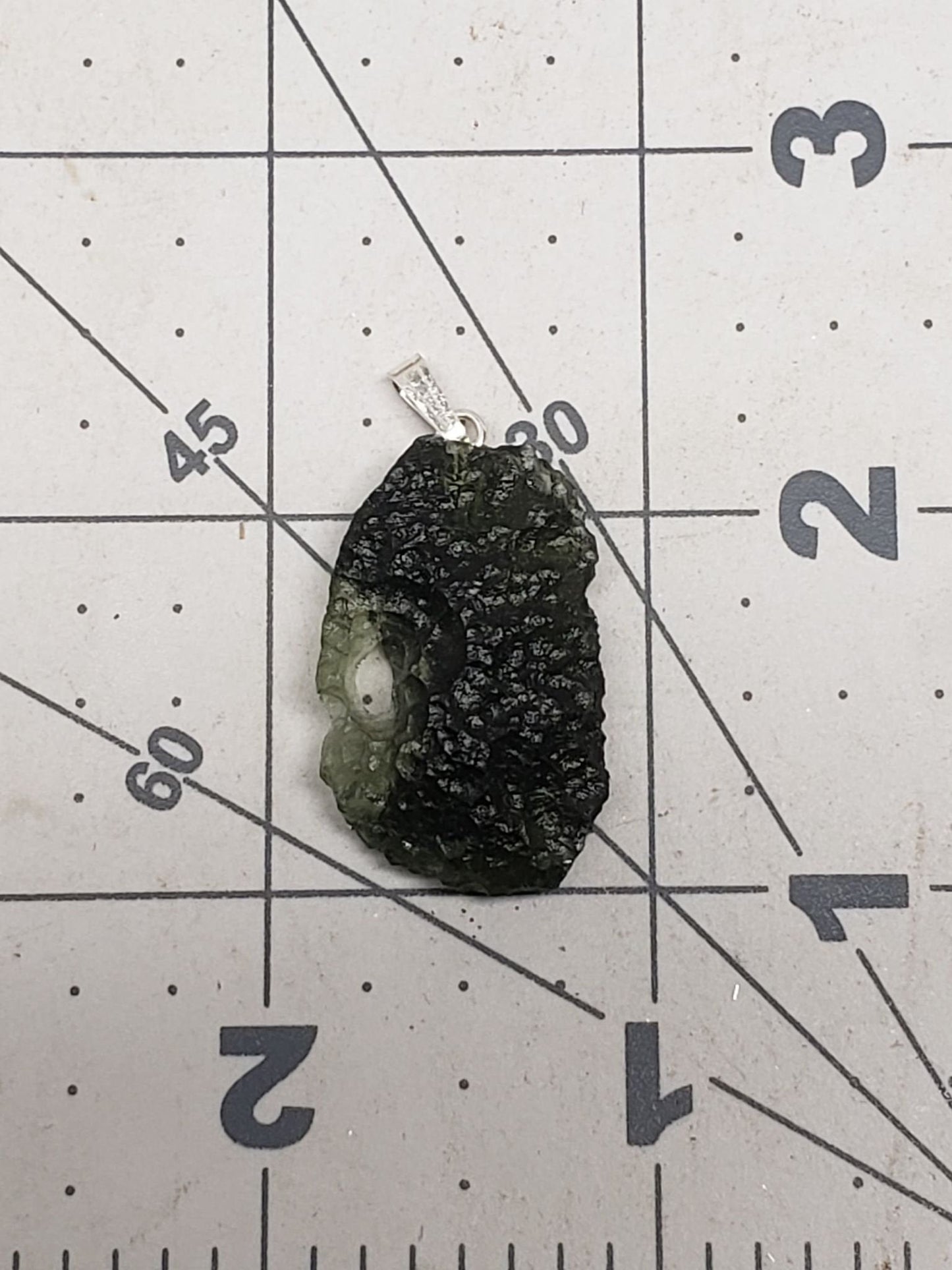 Naturally formed Moldavite from Czech Republic, (5 gr) One Crystal, Rough, with .925 silver bell MOL-0014