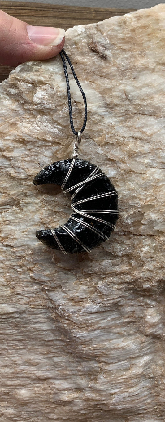 Silver wire wrapped, obsidian knapped moon crystal pendant with asjustable black cord.  