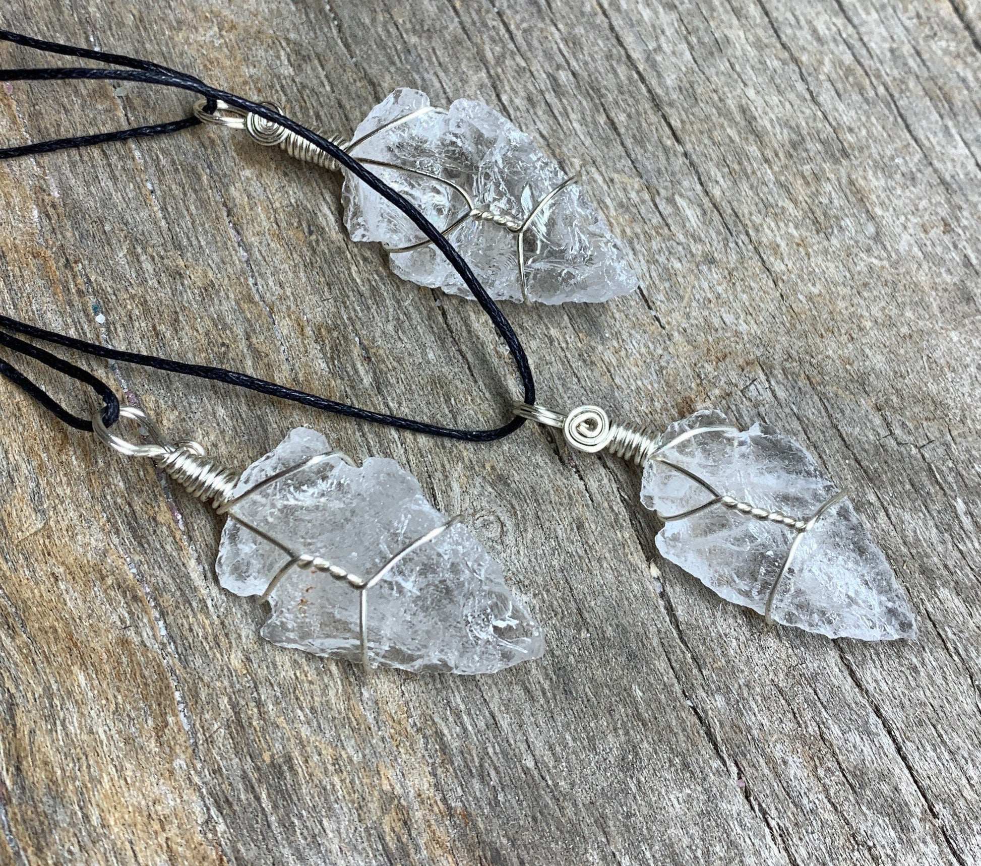 3 silver wire wrapped clear quartz pendants attetched to adjustable black cords