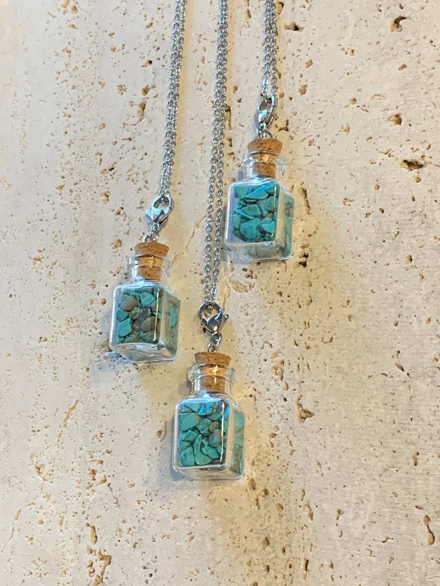 Blue Howlite Necklace 1075 In square corked bottle. 20” chain.