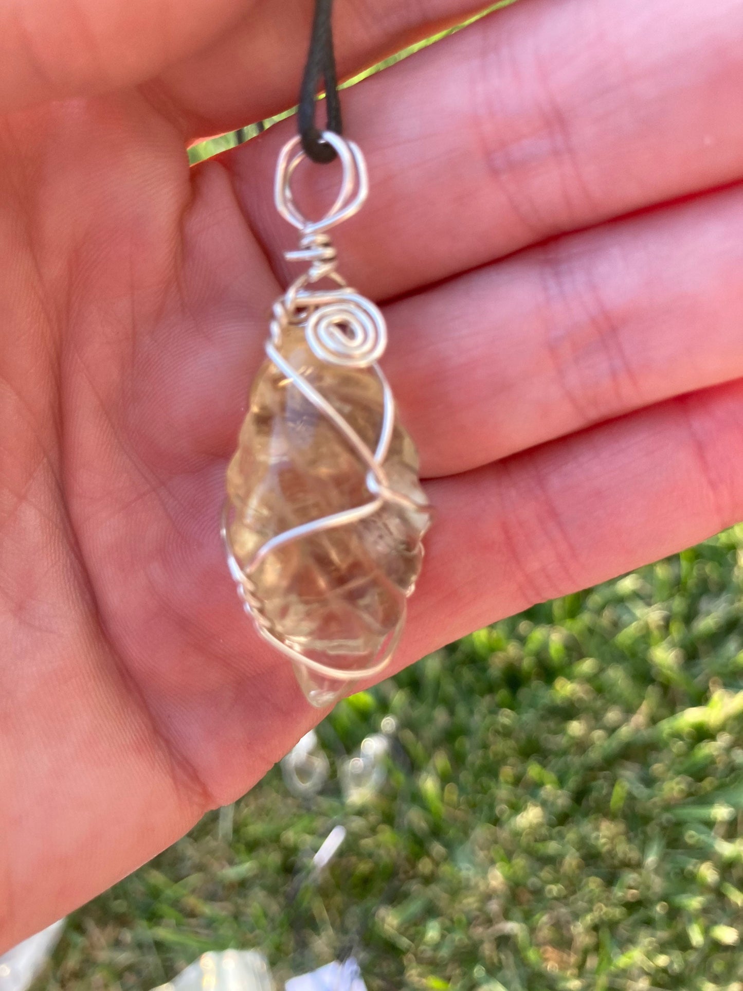 “Handcrafted citrine wire-wrapped necklace with golden gemstone centerpiece.  pendant is approximately 1 1/2 inches long.