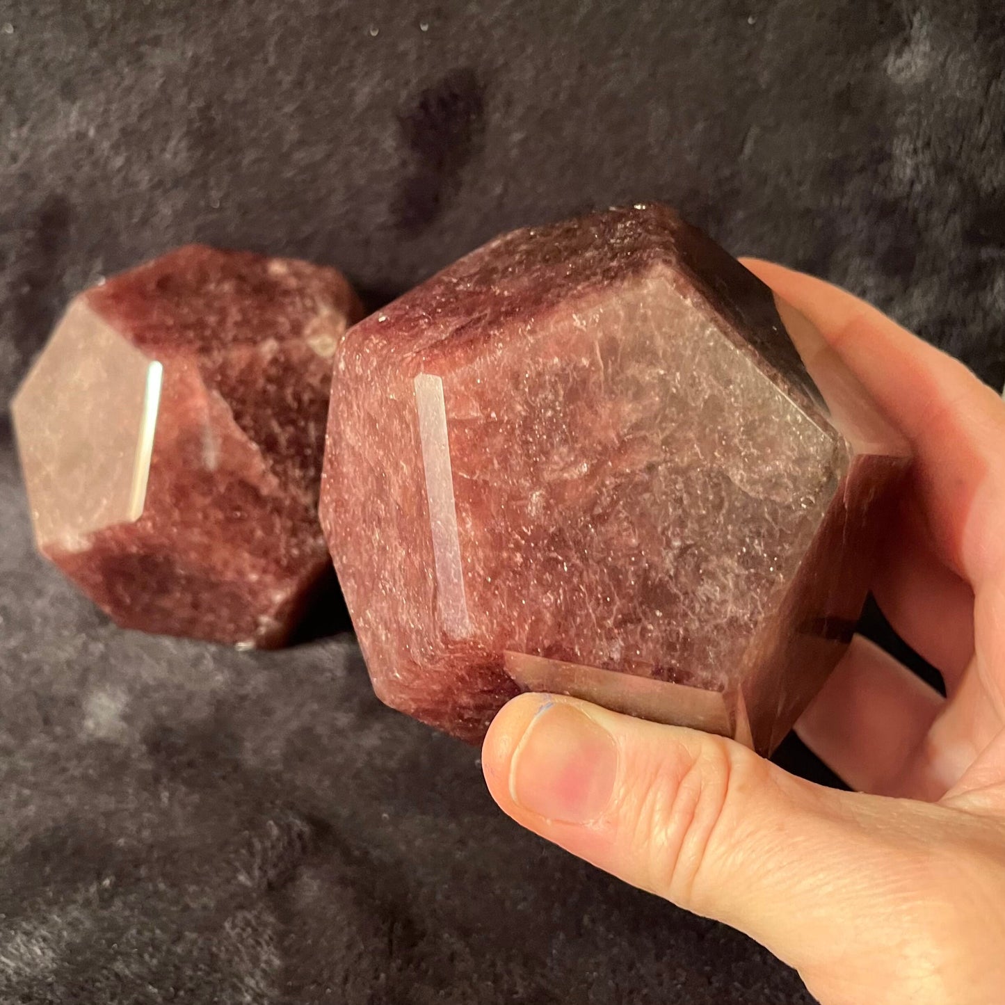 Two large beautiful translucent pink strawberry quartz dodecahedrons, approximately 85 mm in diameter.  