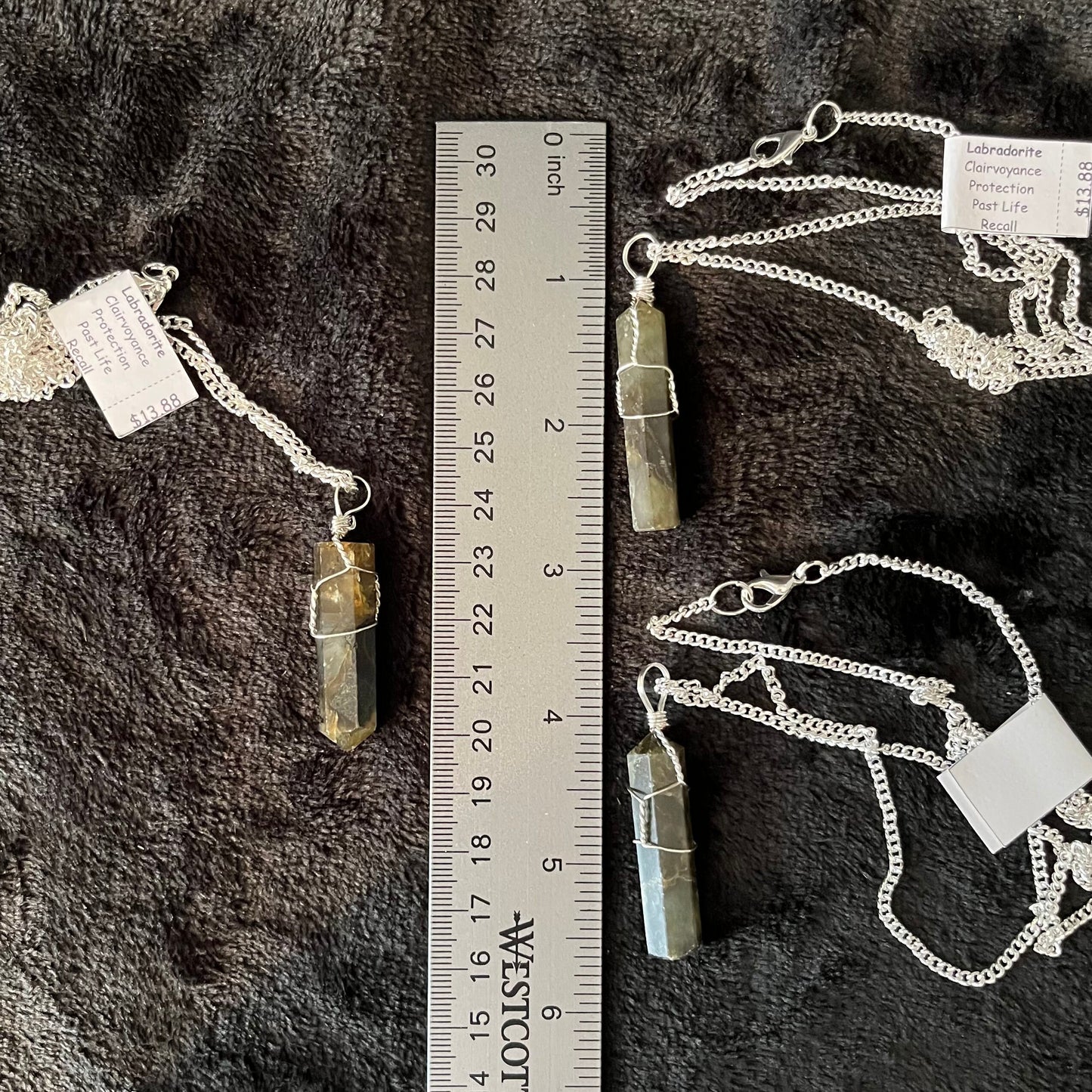 3 Silver Wire Wrapped Labradorite Point Pendants, attatched to silver chains.  Stone are approximately 1 1/4" - 1 1/2" long, displayed next to a ruler.