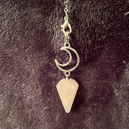 1 inch rose quartz pendulum attatched to an 8 inch silver chain in a silver chain including a crescent moon 