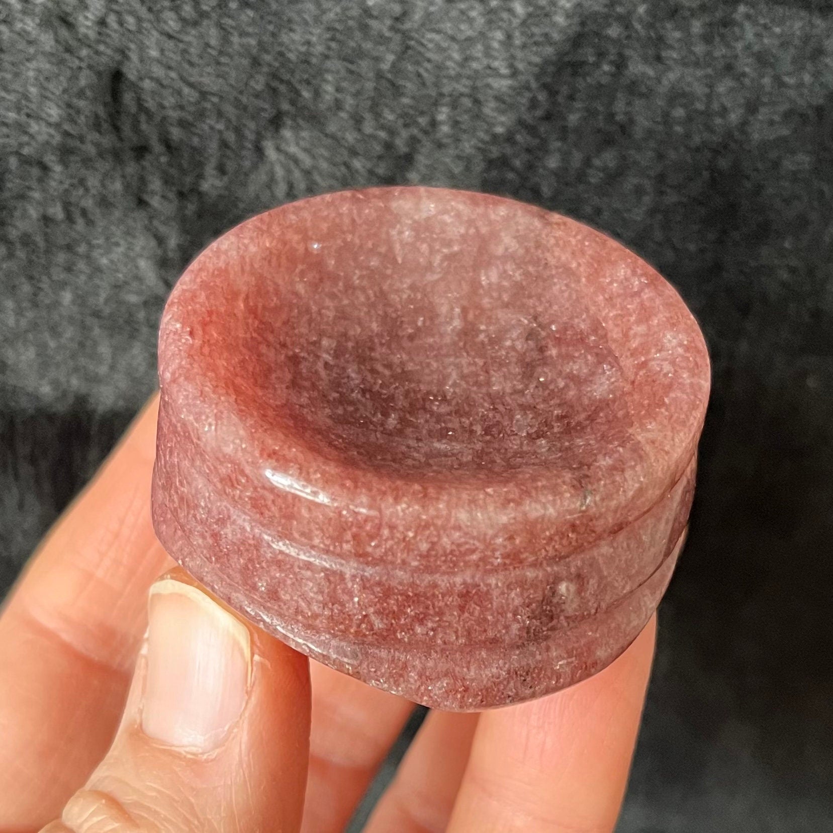 Strawberry quartz sphere stand approximately 2” in diameter.  Strawberry Quartz is  A beautiful pink variety of quartz crystal, featuring delicate hues of pink and red, often resembling the sweetness of ripe strawberries."