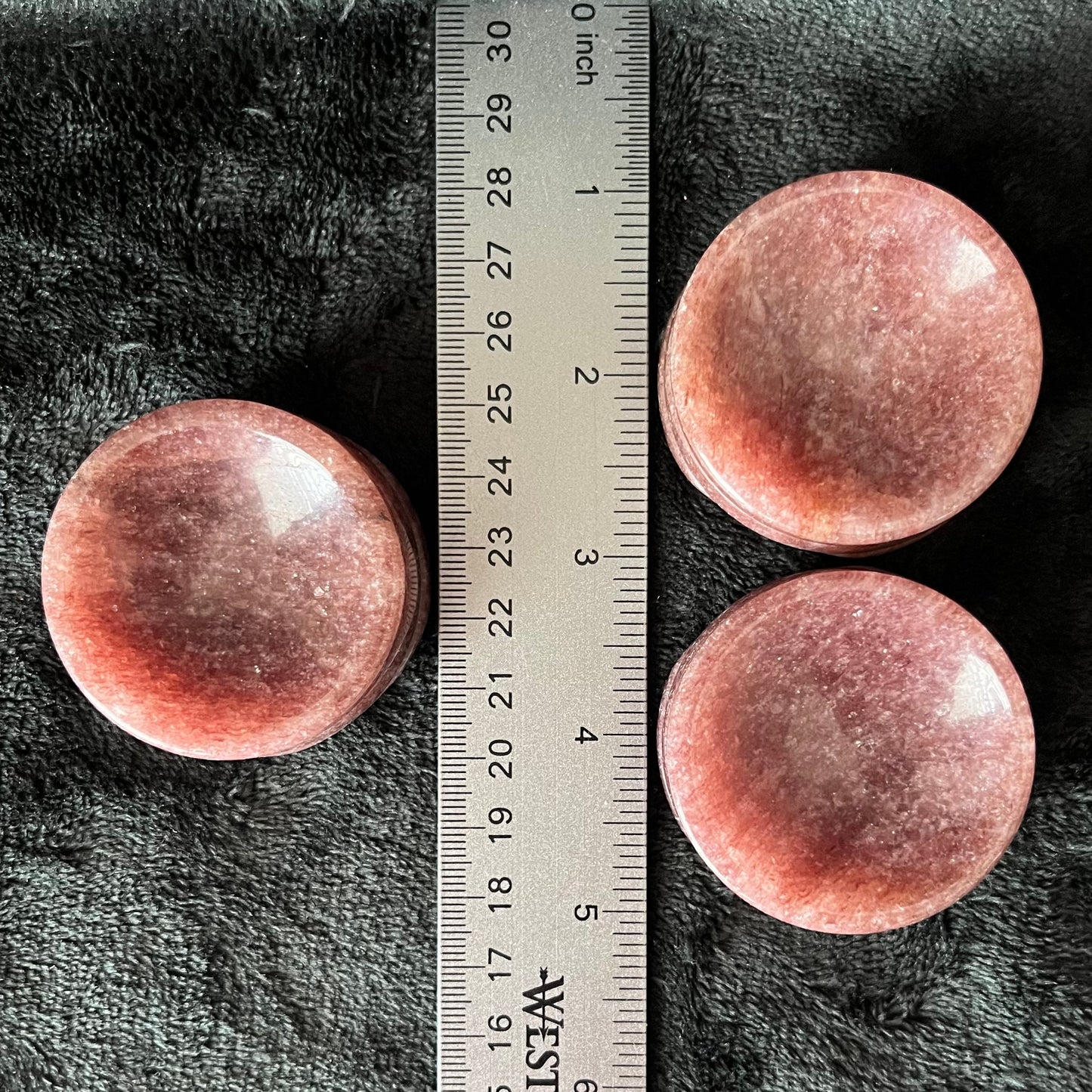 Three strawberry quart sphere stands displayed next to a ruler to chess size. Stands are approximately 1/2 inch high and 2 inches in diameter.