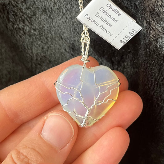 ornately,  tree of life silver wire wrapped  opalite heart, approximately 1" long attatched to a silver chain